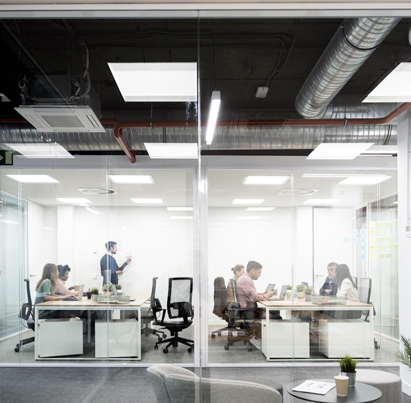 Teams reviewing customer experience workflows in a modern office