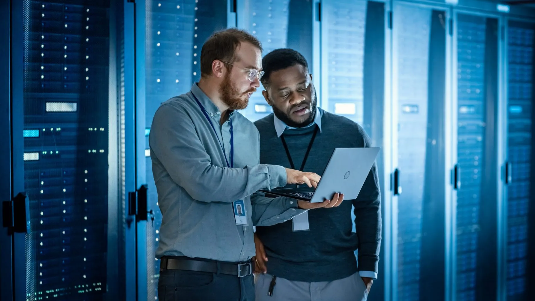Enterprise data operations workspace with teams reviewing business technology systems
