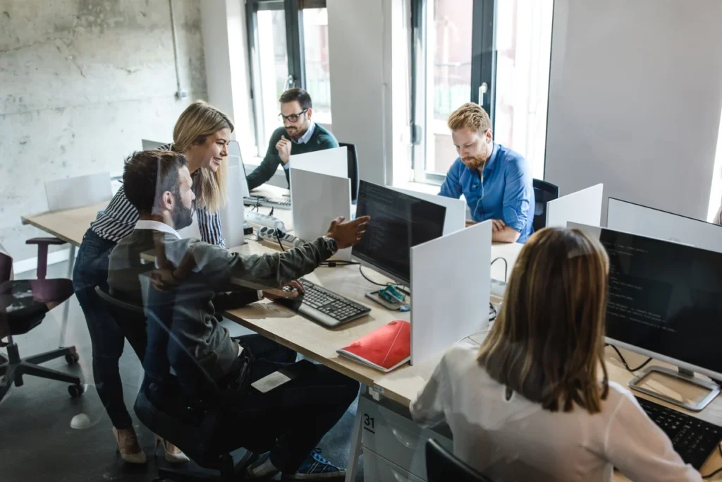 IT team collaborating in a modern workplace
