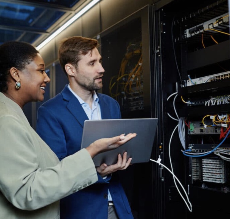 Cloud advisory team reviewing architecture, security, and operational readiness in a modern workspace