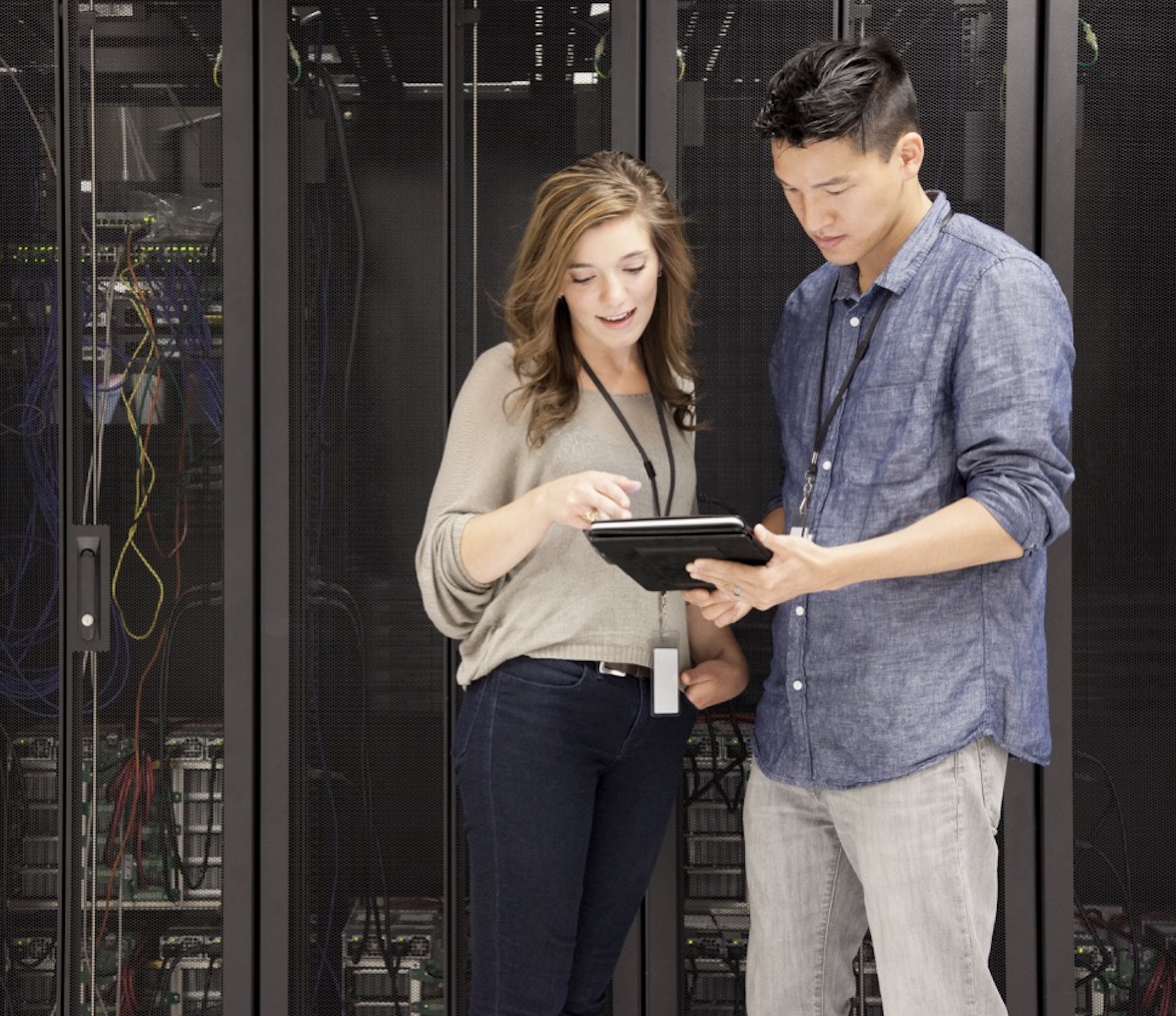 Cloud services team reviewing hosted infrastructure and cloud operations in a modern workspace