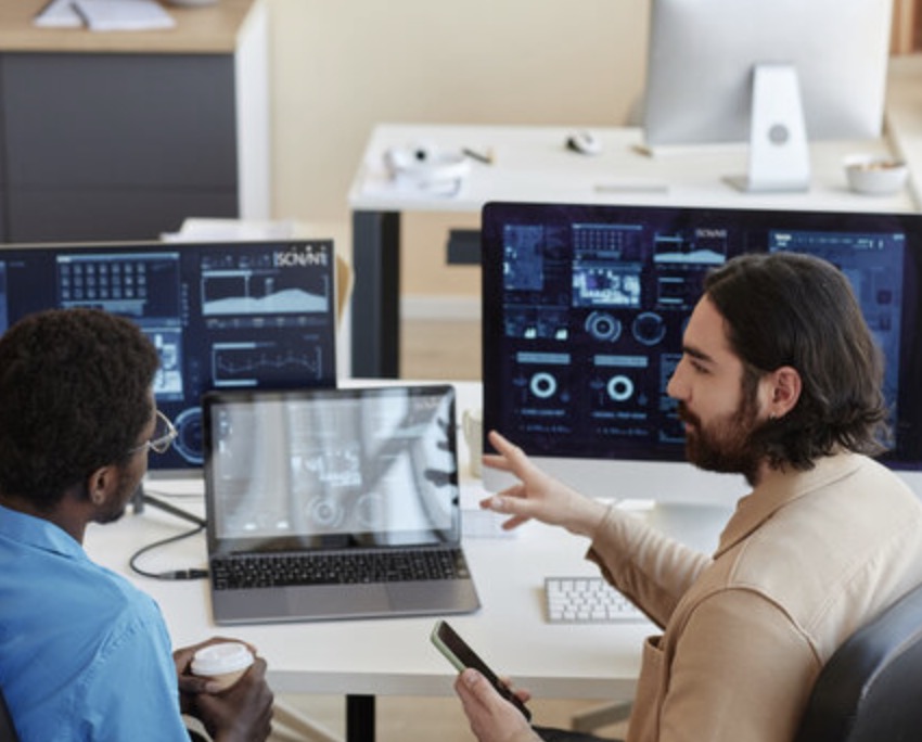 Security operations team reviewing SIEM telemetry in a modern workspace
